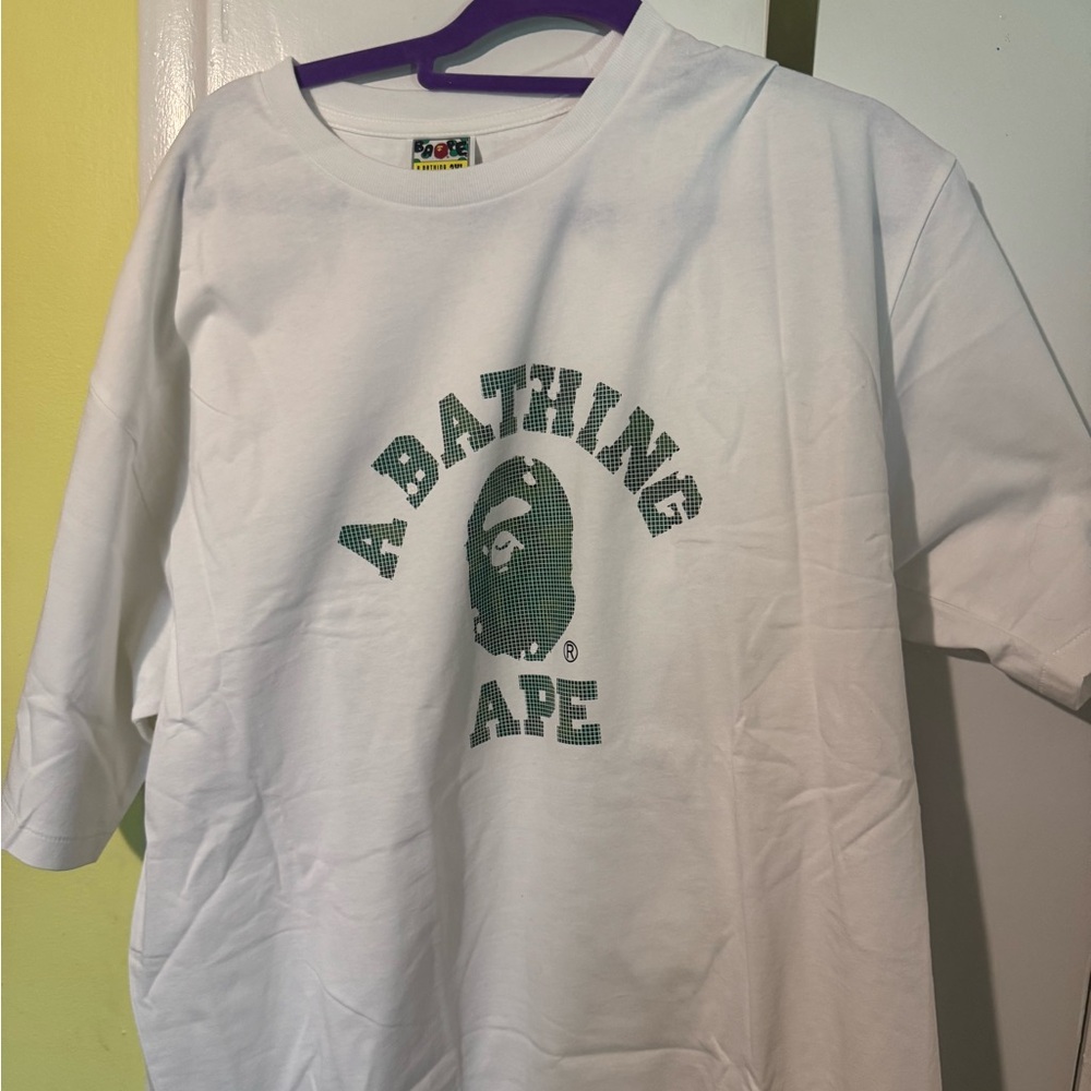 A Bathing Ape White college tee sz 3xl but fits like a Us 2 xl .. New in bag